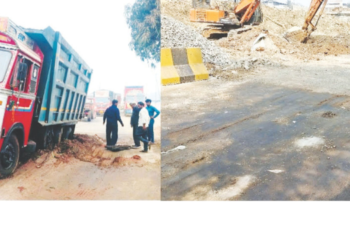 सर्व्हिस रोड खचल्याने ट्रक अडकला